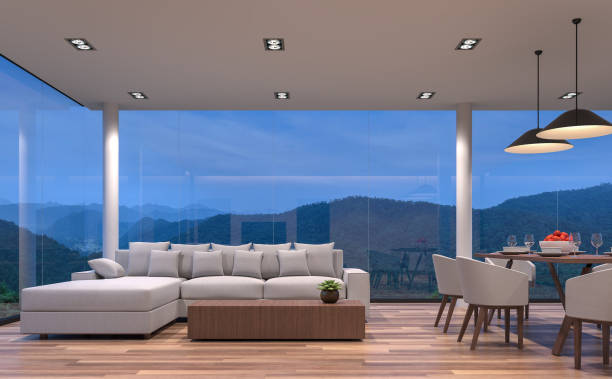 istock Night scene glass house living and dining room with mountain view 3d rendering image 868296538