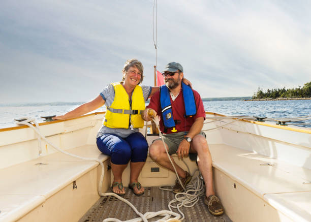istock Senior couple sailing on lake. 868299114