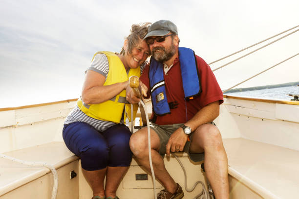 istock Senior couple sailing on lake. 868299128