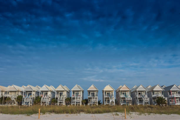 istock Blue Sky with a Row of Beach Homes 868299862