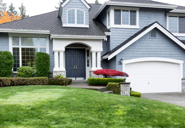 istock Clean home during autumn season with red maple and green front yard 868302380