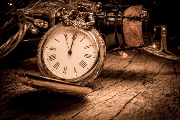 istock New Year Eve celebration background with antique coloc and champagne bottle on rustic wood 868303250