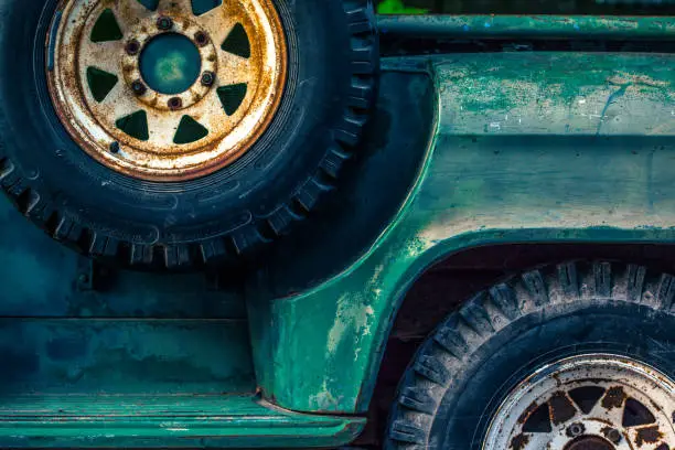 Details of an old green pickup truck styled to enhance the weathered look of the vehicle