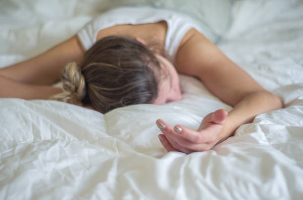 istock Woman fainted in bed. 868313372