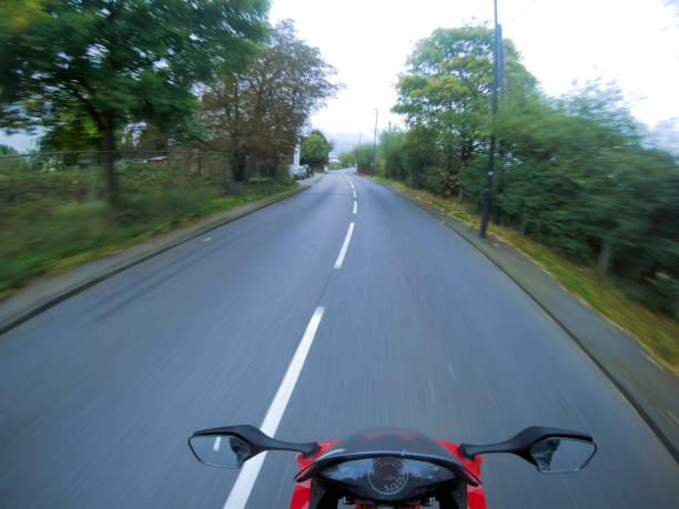istock Motorcycle on wrong side on the road in the UK 868317236