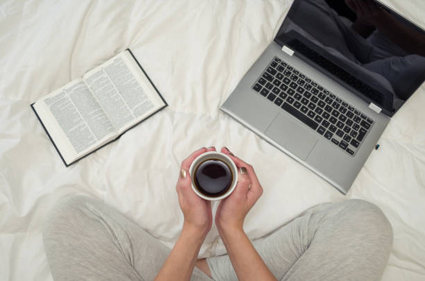istock Woman with crossed legs, reading book and drinking coffee. 868319942