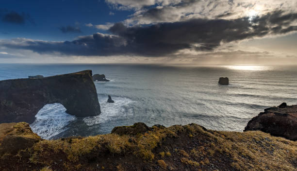 istock Ocean Vista with Sea Arch and Sunset 868323228