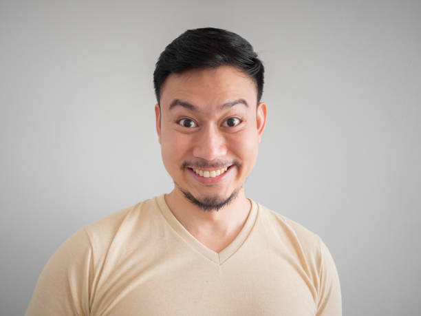 istock Headshot of happy Asian man. 868324446