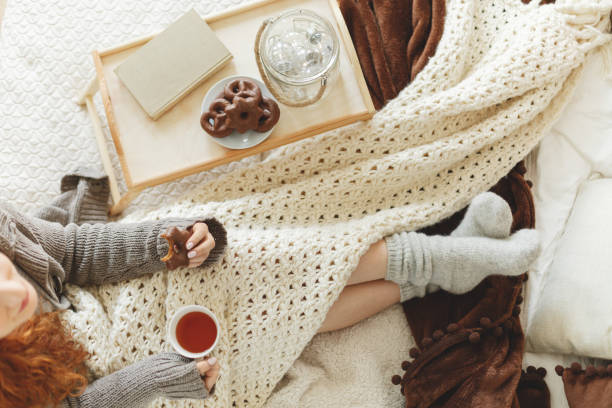 istock Girl eating gingerbread with tea 868324502