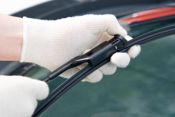 istock replacement of windscreen wipers on a motor vehicle, service worker 868334328
