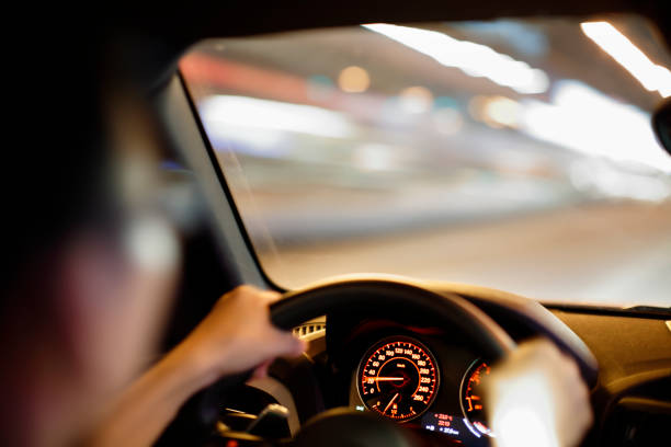 istock driver in the car at night 868335872