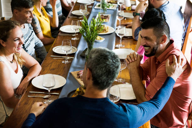 istock Group of diverse friends are having a dinner together 868335974