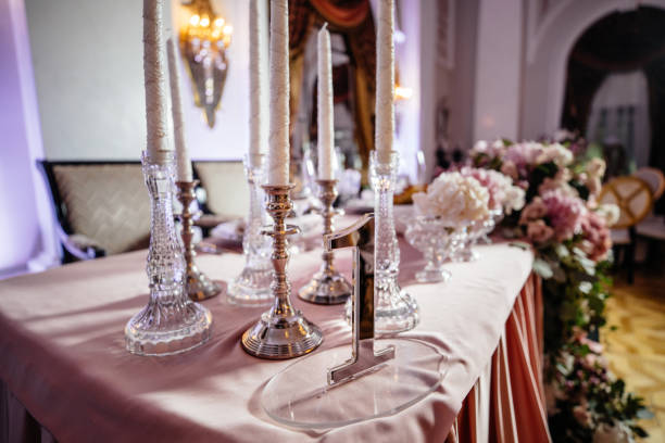 istock Plates with bread stand among sparkling glassware on table served for wedding dinner 868338688
