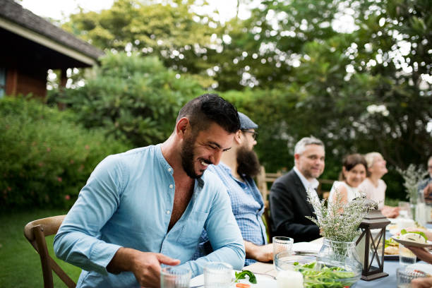 istock Group of diverse friends are having a dinner together 868338806