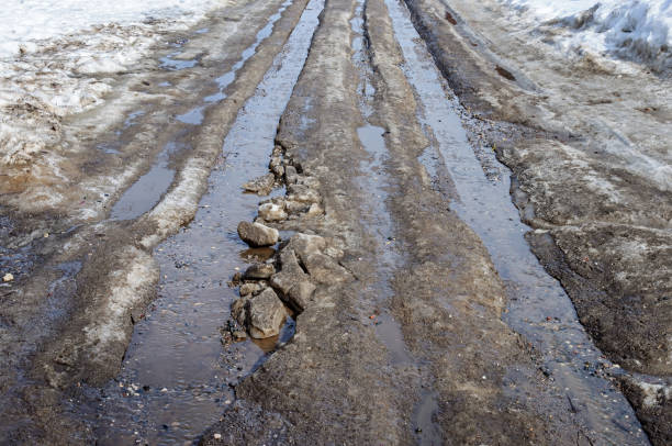 istock Country road with melting snow 868345978