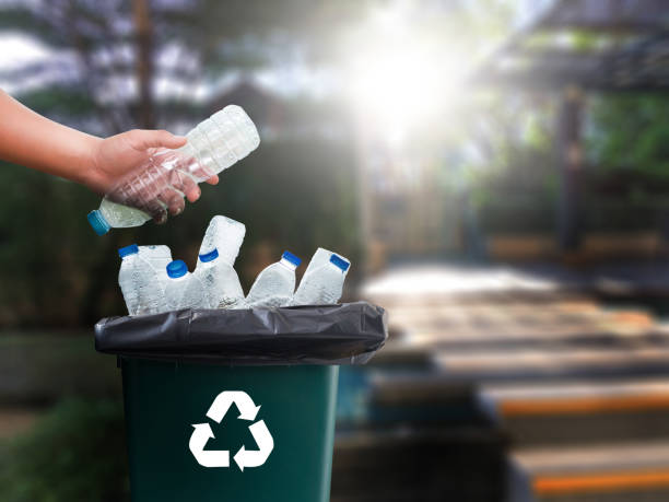 istock man hand putting plastic reuse  for recycling concept environmental protection world recycle 868349172