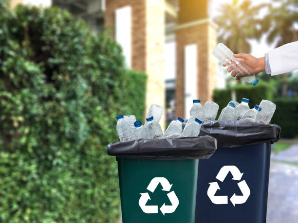istock man hand putting plastic reuse  for recycling concept environmental protection world recycle 868349176