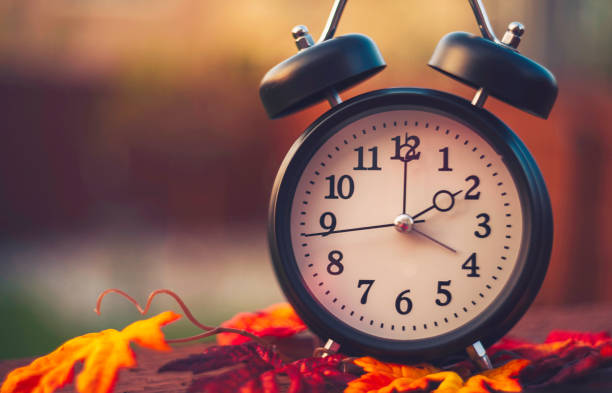 Daylight savings time clocks fall back in Autumn Daylight savings time. Clocks fall back in Autumn daylight saving time stock pictures, royalty-free photos & images