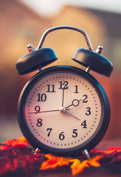 istock Daylight savings time clocks fall back in Autumn 868352562