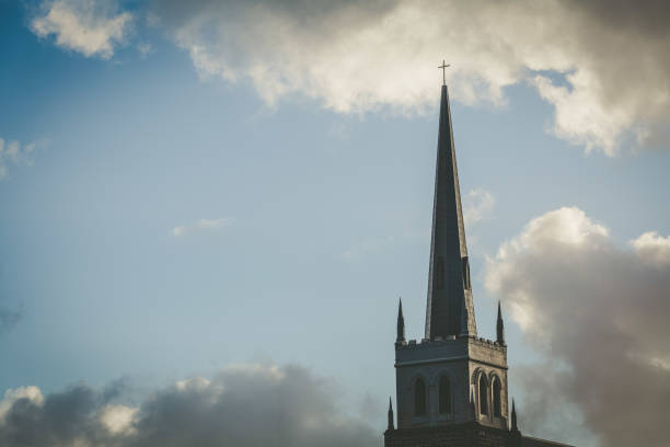 Church steeple with copy space in sky and clouds in the background