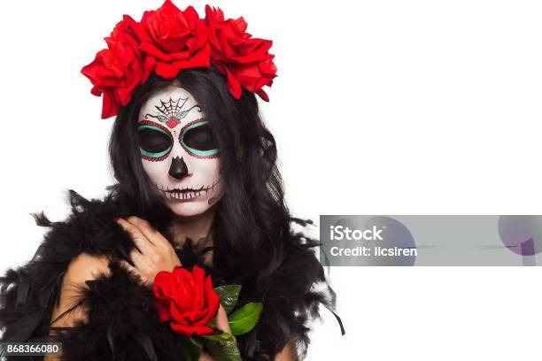 Day Of The Dead Halloween Young Woman In Day Of The Dead Mask Skull Face Art And Rose Isolated On White Closeup Stock Photo - Download Image Now