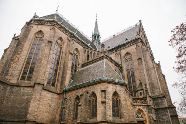 istock Beautiful old Gothic cathedral - sightseeing of Prague. Overcast. Winter. 868366130