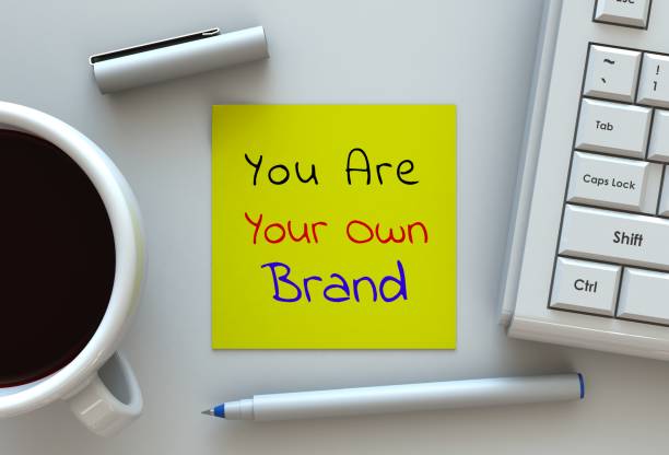 istock You Are Your Own Brand, message on note paper, computer and coffee on table 868368916