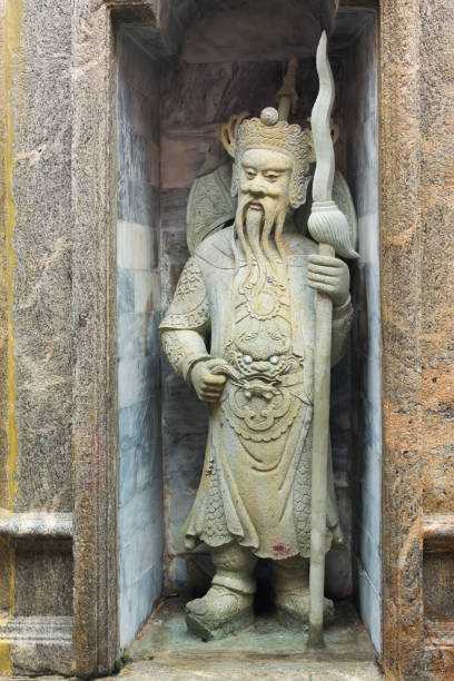 istock Close-up Ancient Chinese Ballast Doll. In the marble frame. 868379728