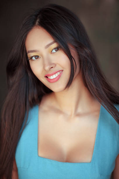 istock Smiling asian woman portrait 868381844