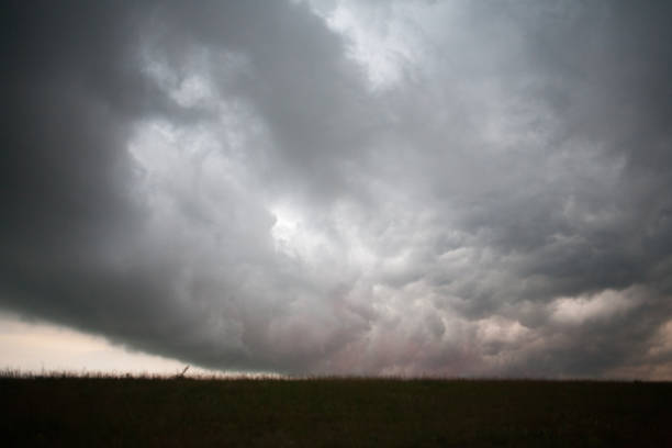 istock gloomy sky over a field in nature 868385314