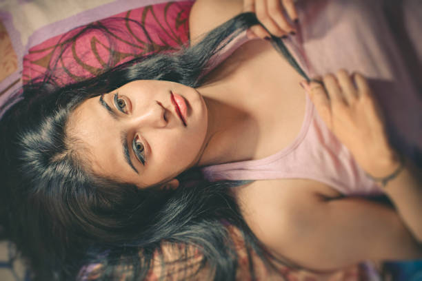istock Beautiful young woman relaxing at home. 868385596