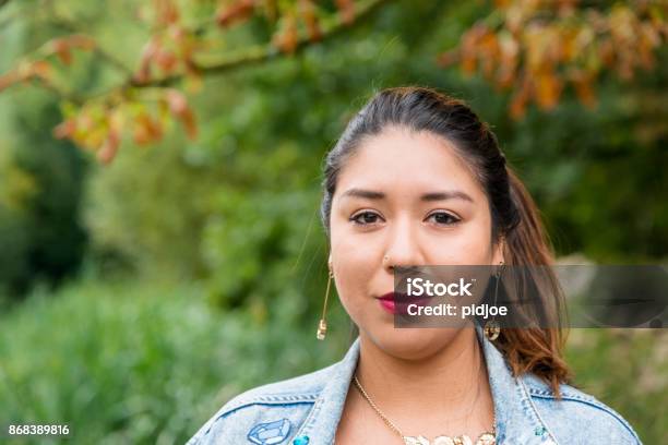 Portrait Of A Young Latin Woman Looking At Camera Stock Photo - Download Image Now - One Woman Only, 25-29 Years, Latin American and Hispanic Ethnicity