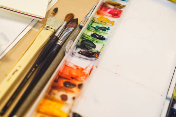istock Classic natural brushes for drawing with watercolors and a palette with different paints prepared for drawing. 868392762