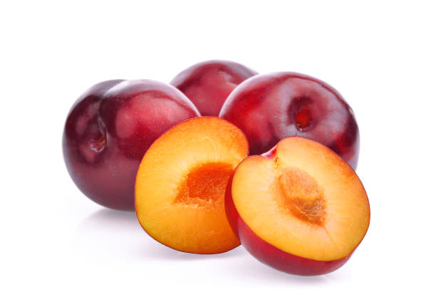 istock whole and half with slice of red cherry plums isolated on white background 868392998