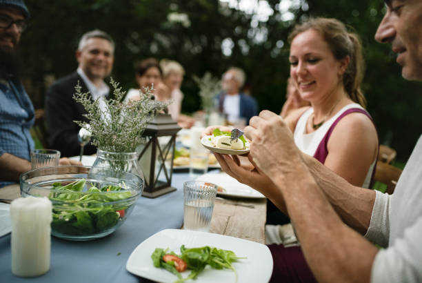 istock Group of diverse friends are having a dinner together 868396476