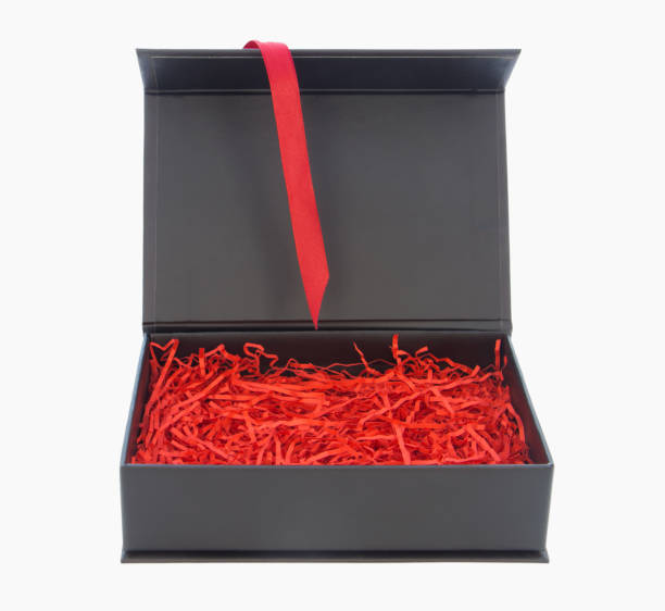 istock Black box with red filler and ribbon isolated on white 868400980