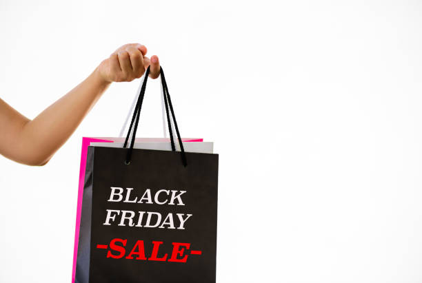 istock Hand holding Black Friday shopping bag on white blackground. 868401498