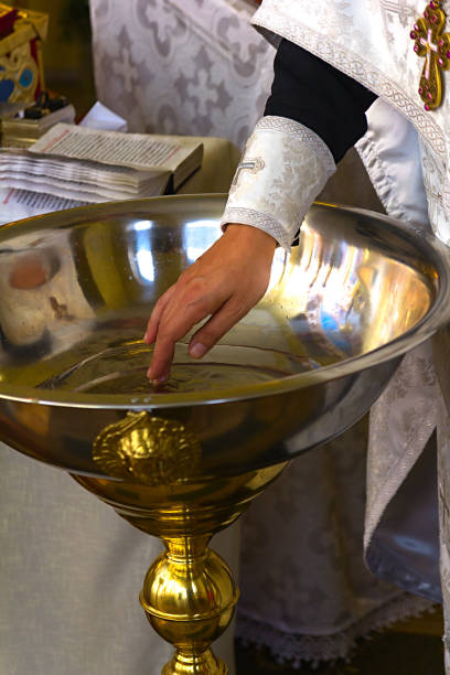 istock priest in church 868403818