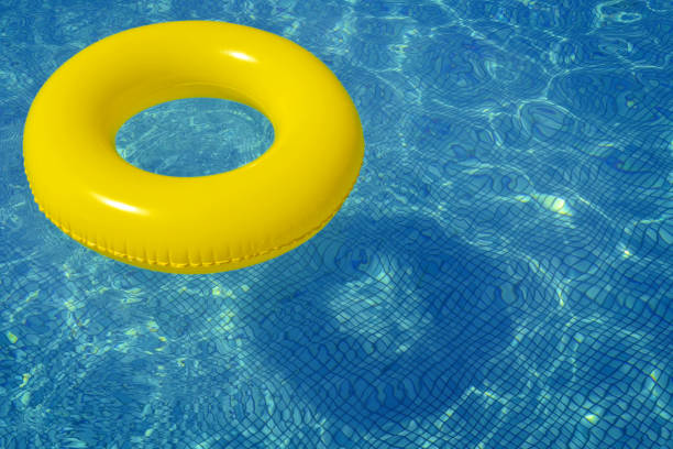 istock Colorful inflatable tube floating in swimming pool 868403862