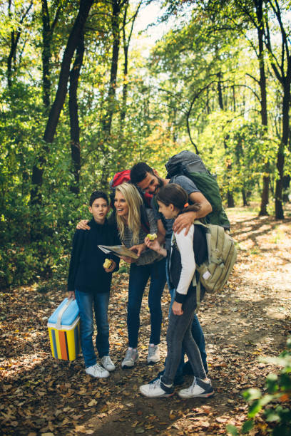 istock Family hiking together in forest 868404734
