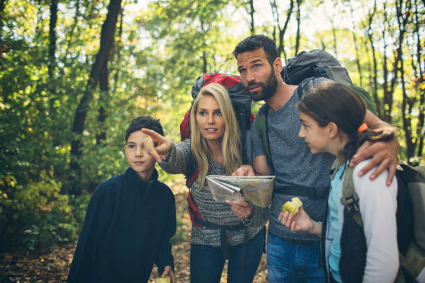 istock Family hiking together in forest 868405270