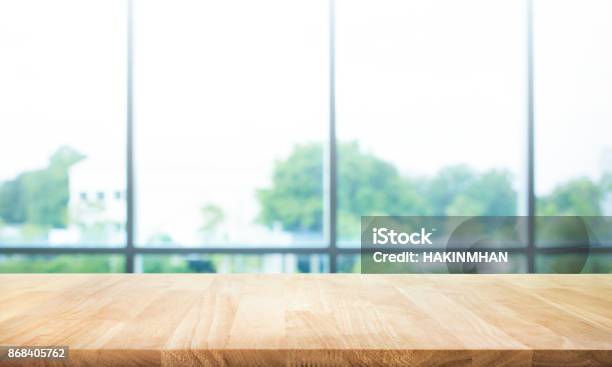 Wood Table Top On Blur Green Garden From Window View Stock Photo - Download Image Now