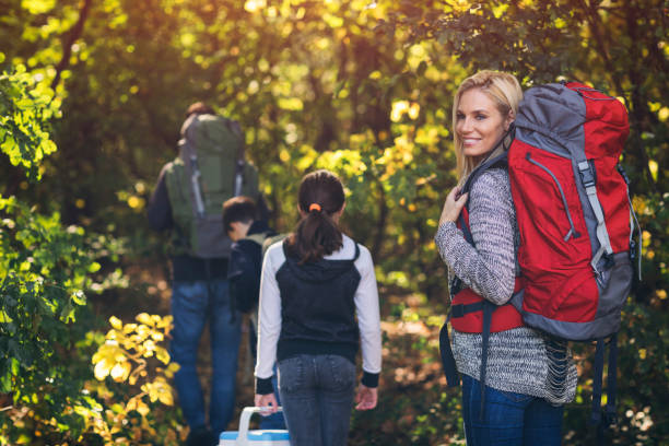 istock Family hiking together in forest 868405814