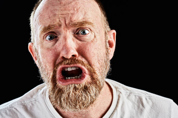 istock Upset mature, bearded man grimaces in shock and sadness 868405970