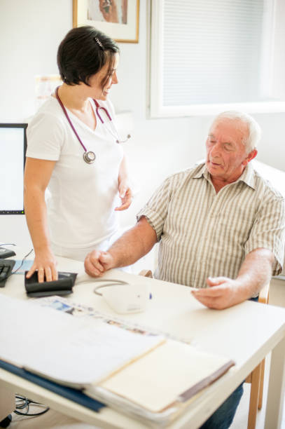 istock Senior Man Visiting Doctor's Office In The Retirement Home For A Check-Up 868412490