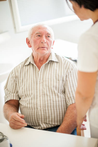 istock Senior Man Visiting Doctor's Office In The Retirement Home For A Check-Up 868412514