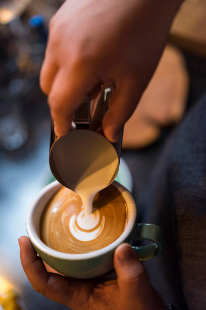 istock Barista pouring milk for latte art 868417194
