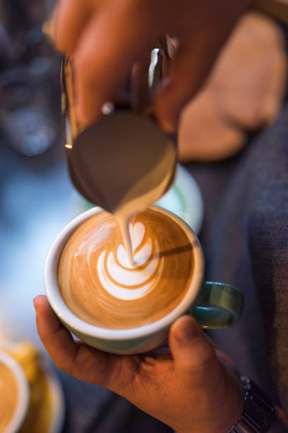 istock Barista pouring milk for latte art 868418052