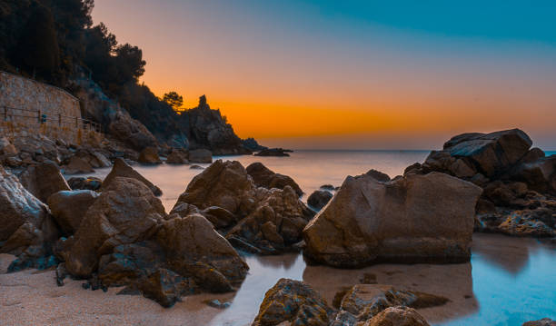 Dawn on the beach on the Costa Brava in Catalonia, Spain stock photo