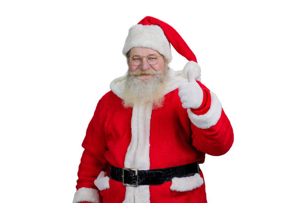 istock Smiling Santa giving thumb up. 868422450